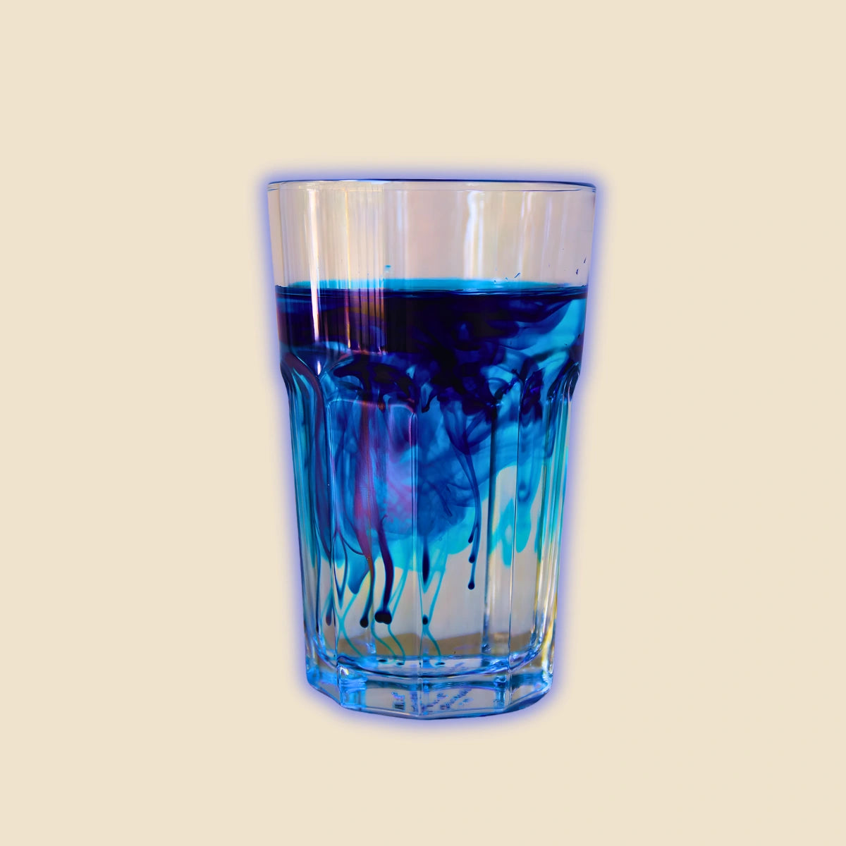 Glass of purified water with dissolved VitaBlue Methylene Blue, symbolizing cellular energy, focus, and mitochondrial activation